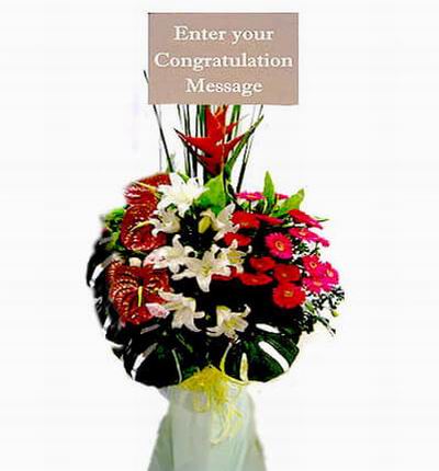 Flower Stand of Lilies, Daisies and Anthuriums with large leaves